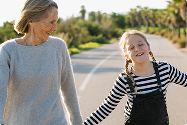 mom with hearing aids listening to child